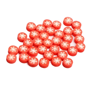 Red polymer clay beads with white snowflake pattern for DIY jewelry making