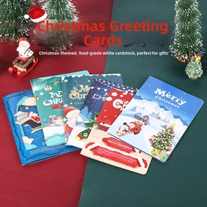 Detail of Christmas greeting cards made of white cardboard with Merry Christmas lettering