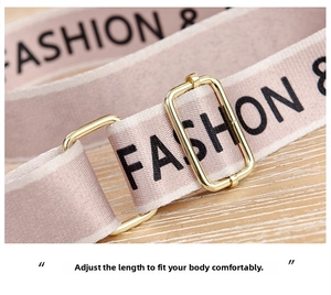 Pink woven canvas shoulder strap with adjustable gold buckle and fashion text detail