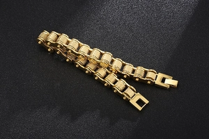 Macro shot of golden motorcycle chain bracelet for men with premium metal texture detail