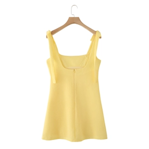 Detail view of yellow gingham dress back with zipper closure and thin shoulder straps