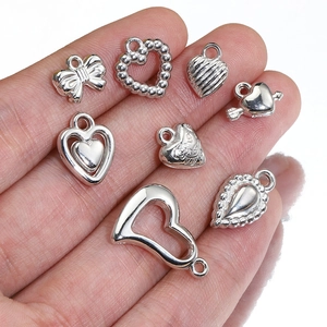 Silver heart and bow charm set for Y2K DIY jewelry making in polished metallic finish