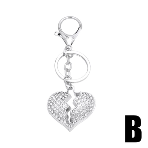 Sparkling crystal encrusted broken heart keychain in silver alloy with lobster clasp