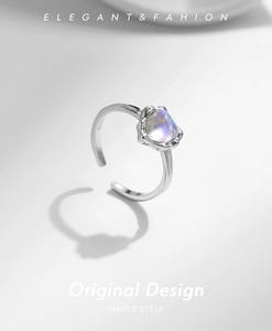 Macro shot of S925 sterling silver ring featuring an irregular moonstone with blue luster
