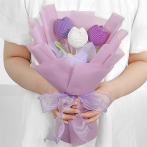 Beautiful hand-knitted crochet tulip bouquet in purple and white, ideal creative holiday gift