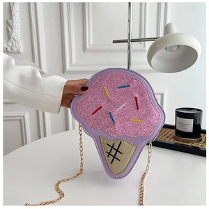 Detail of cute pink and purple ice cream shaped crossbody bag with gold chain strap