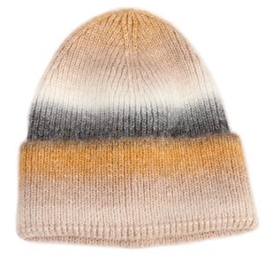 Detail of multi-color gradient chunky knit beanie with soft striped texture and folded cuff