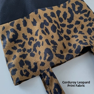 Detail of leopard print corduroy and black canvas patchwork on the tote bag surface