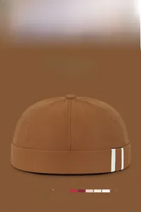 Detail view of cotton docker hat with parallel stripes and available color options