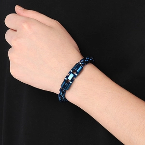 Blue stainless steel basket weave chain bracelet with unique jewelry clasp on wrist