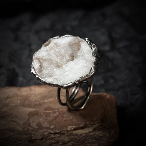 Macro shot of natural white druzy quartz crystal on handmade silver adjustable ring band