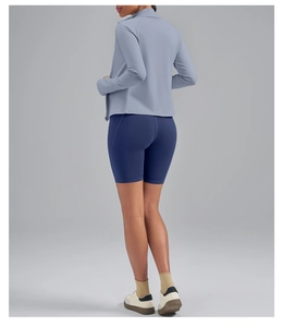 Detail view of the back seams on a slim-fit yoga jacket and matching cycling shorts