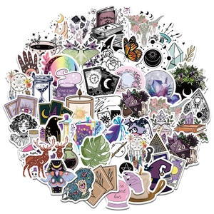 Macro shot of assorted mystical witchcraft stickers with tarot cards and crystals