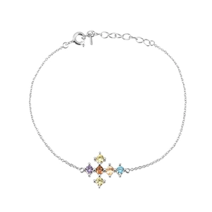 Macro detail of silver cross pendant with colorful purple, orange, yellow, and blue gems