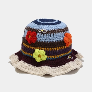 Handmade crochet floral bucket hat with multi-color stripes and bohemian knit details