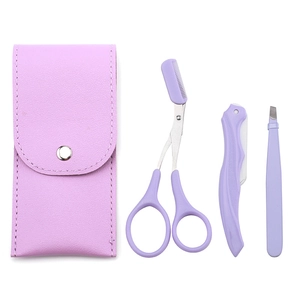 Purple eyebrow grooming set including a folding razor, scissors with comb, and tweezers