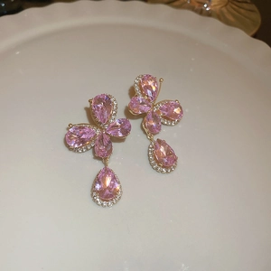 Detail shot of butterfly drop earrings with pink water drop crystals and small diamonds