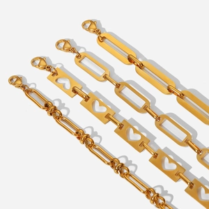 Detailed view of hollow heart and chain link gold-plated stainless steel bracelets
