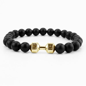 Detailed close-up of matte black beads with a golden dumbbell featuring LIFT engraving