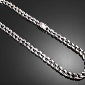 Detail of 12mm polished silver Cuban link chain bracelet with durable box clasp closure