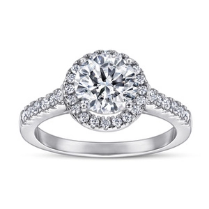 Top-down view of a round-cut Moissanite ring with a halo setting and paved silver band