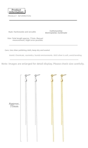 Detail view of 77mm long tassel drop earrings in S925 silver and gold plating