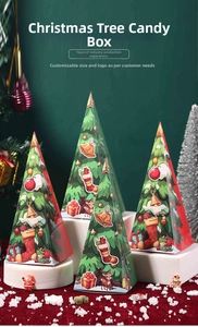 Triangle Christmas tree candy boxes with festive reindeer and bell prints on white stands