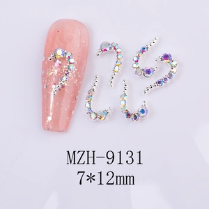 Macro detail of 7x12mm heart shaped iridescent rhinestones for nail art decoration