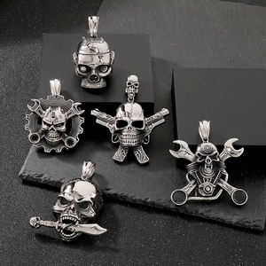 Mechanical punk skull pendants with crossed pistols and wrench details in silver metal