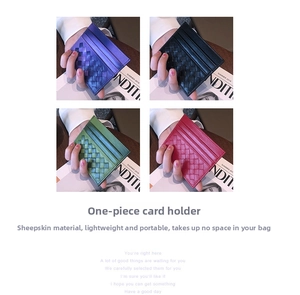 Slim woven sheepskin card holder showing purple, black, green and red color options