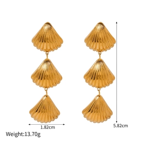 Detailed view of layered gold shell earrings with dimensions 1.82cm by 5.82cm