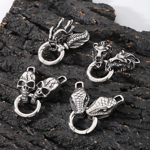 Punk style stainless steel snake and dragon head spring clasps on rustic bark background