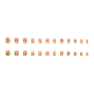 Press-on nail set with 24 pieces in blush gradient with green accents and small rhinestones