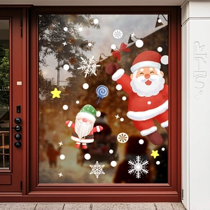 Christmas window clings featuring Santa, Gnomes and snowflakes on a glass door