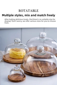 Set of rotatable acacia wood cake trays with transparent glass lids in four sizes