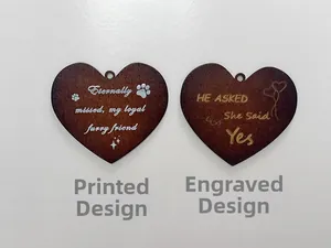 Detail of heart-shaped wooden pendants with custom white printing and laser engraving