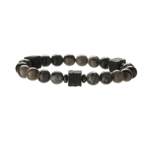 Macro detail of natural stone beaded bracelet with grey round beads and black lava stones