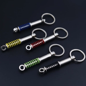 Detailed view of colorful shock absorber keychains in blue yellow red green and black metal