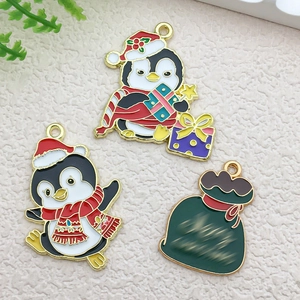 Detail of Christmas penguin and gift bag alloy charms for DIY jewelry making