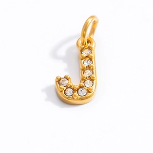 Detail of 18K gold letter J pendant featuring sparkling white round zircon stones