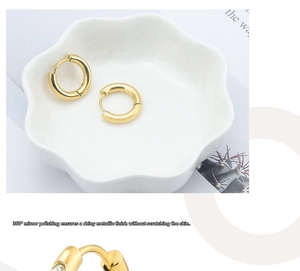 Macro detail of 360-degree mirror polished gold round hoop earrings with zircon