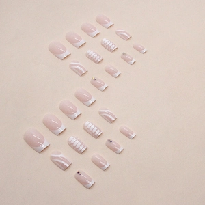Minimalist white bone pattern press-on nails set with subtle crystals and French tip