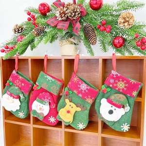 Detailed view of four festive Christmas stockings hanging on a rustic wooden mantel