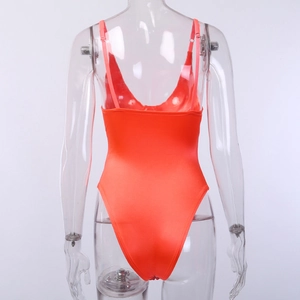 Detail of red satin bodysuit with thin straps and deep V-back on transparent mannequin