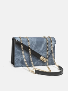 Denim blue square chain bag with black leather trim and gold hardware from 45-degree angle