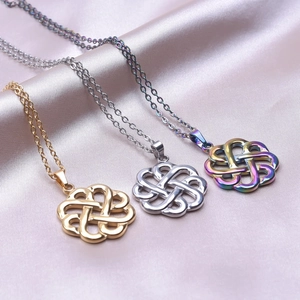 Witch knot necklace in gold, silver, and rainbow colors on elegant silk fabric
