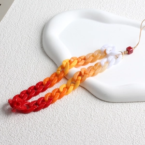 Detailed shot of red and orange gradient acrylic thick link mobile phone charm strap
