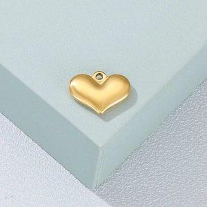 Polished gold 3D heart-shaped titanium steel pendant charm on light green stand