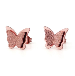 Elegant rose gold butterfly stud earrings with frosted metal texture on white background