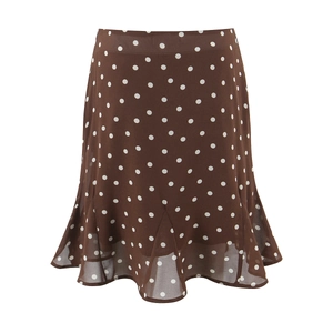 Detailed view of brown polka dot chiffon skirt featuring a ruffled fishtail hemline